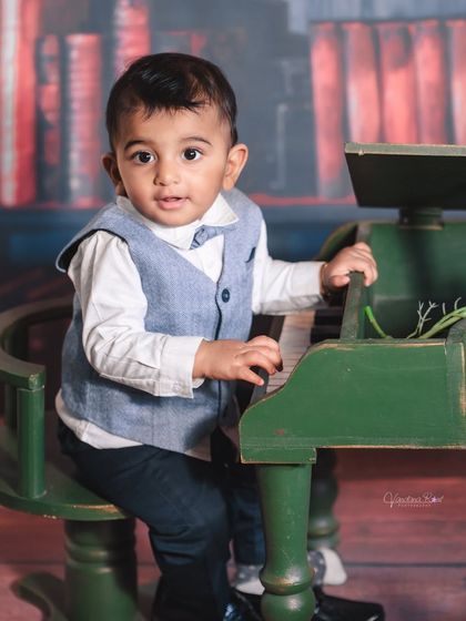 A gallery of our popular school and library theme. These images show the versatility of the brick wall backdrop, mini school desk, globe, and book props for creating a variety of scholarly and classic portraits.