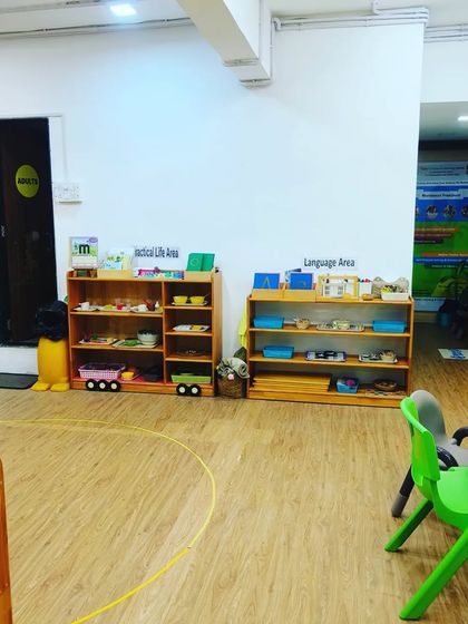 I can turn any space, like this Practical Life and Language Area, into a playground for learning and movement. My equipment is portable and safe, allowing me to set up a fun and effective fitness session anywhere.
