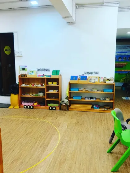 I can turn any space, like this Practical Life and Language Area, into a playground for learning and movement. My equipment is portable and safe, allowing me to set up a fun and effective fitness session anywhere.