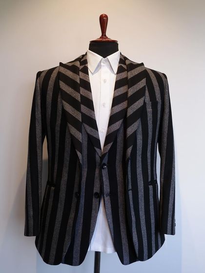 We play with patterns, like these chevron-matched lapels on a striped flannel jacket, for a unique and eye-catching design.