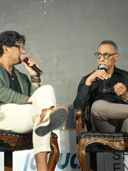 In conversation with a fellow panelist at the iGen event, discussing how to build a greener future.