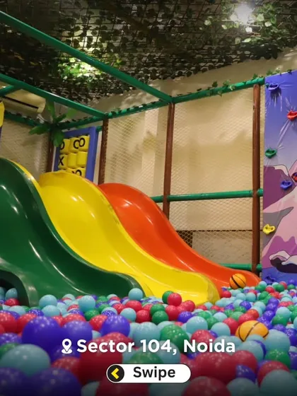 Another view of the triple slides plunging into the massive ball pit, one of the most popular attractions in the entire play zone.