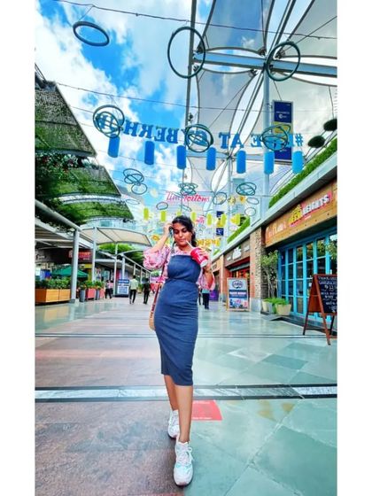 A casual look for a day out at Cybercity, Gurugram. I layered a pink printed shirt over a simple blue bodycon dress and paired it with white sneakers for a comfortable, street-style vibe.