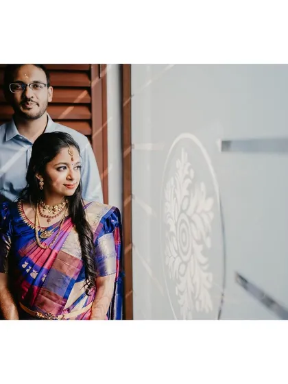 A beautifully composed shot of the couple. The soft lighting adds a romantic feel to their engagement photos.