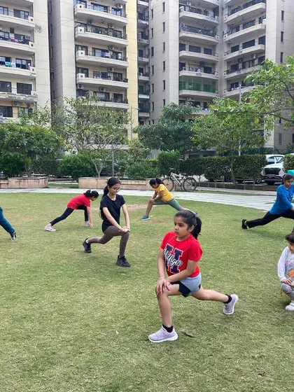 Our outdoor fitness classes for kids are a great way to build stamina and strength in the fresh air. Here, a group is working on lunges and other conditioning exercises at our RPS Savana Park location.