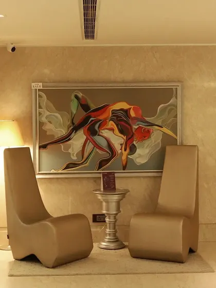 A sanctuary for self-care amidst sophistication. This view of our waiting area showcases the elegant and comfortable environment we have created for our clients.
