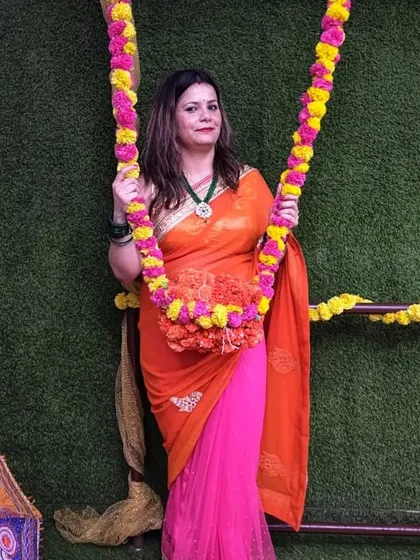 Another happy member posing on the floral swing during our Teej party.