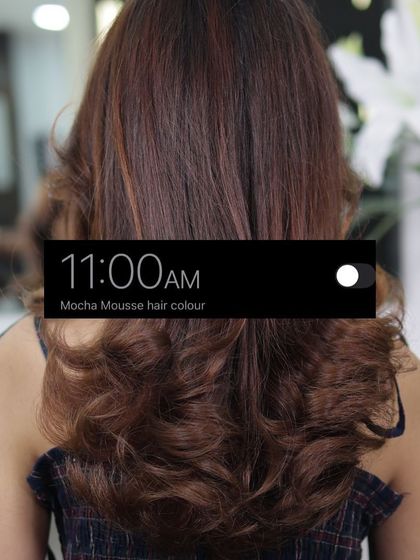 The final reveal. At 11:00 AM, the Mocha Mousse hair colour is complete, showcasing a rich, beautiful shade with soft, bouncy waves.
