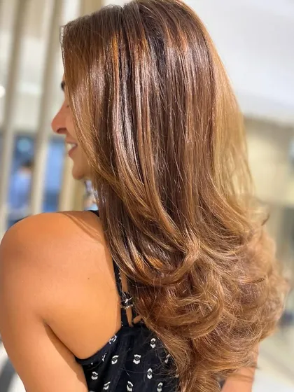 Another angle of this sun-kissed hair. You can really see the dimension in the color and the beautiful shape of the layered haircut.