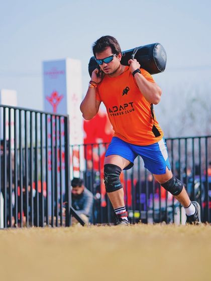 Another shot of the sandbag carry, showing the focus and determination required. You have to respect the grind and just keep moving forward.