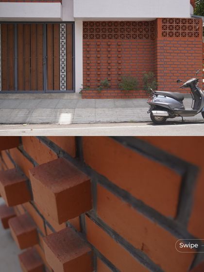 A close-up of the textured brickwork on the exterior, where bricks are laid in a projecting pattern to create a play of light and shadow.