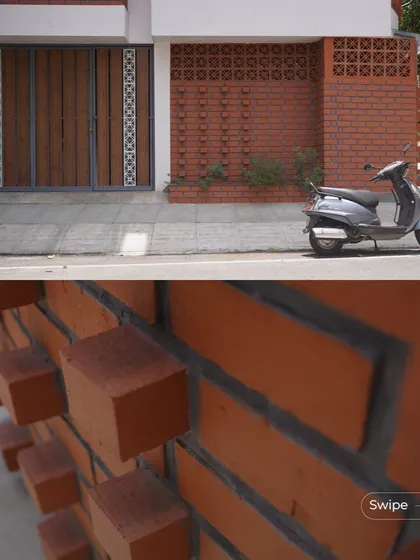 A close-up of the textured brickwork on the exterior, where bricks are laid in a projecting pattern to create a play of light and shadow.