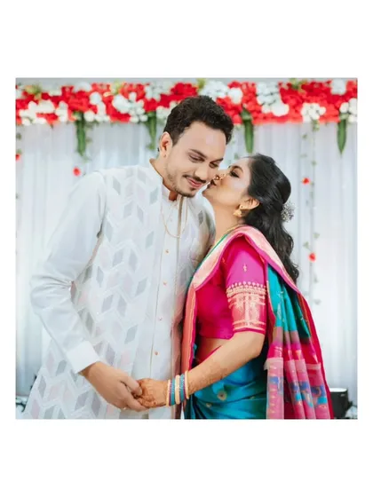 A sweet, spontaneous kiss on the cheek. These are the candid moments that truly reflect a couple's affection and make for the most heartwarming engagement photos.