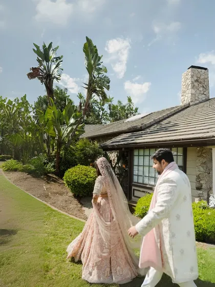 Walking towards their future, together. This shot captures the couple in the natural, relaxed setting of their backyard wedding, the simplicity of the moment reflecting the authenticity of their love.