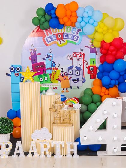 A charming 'Farm' themed birthday party, with rustic decor, animal cutouts, and hay bale props, perfect for a country-style celebration.