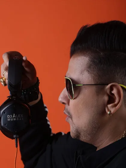 A profile shot showcasing my custom 'DJ Alex Mumbai' headphones. Every detail is part of the brand.
