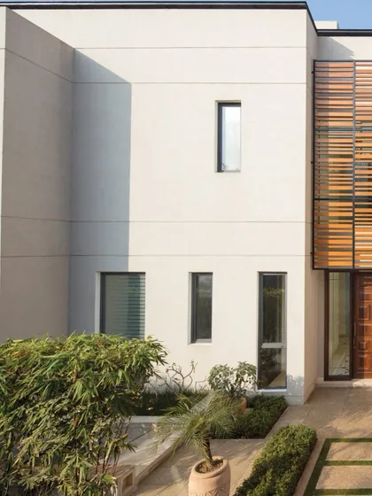 The Equilibrium Houses in New Delhi are an exercise in minimalism and light. The clean lines and large glass doors invite natural light to flood the interiors, creating a sense of openness and transparency.