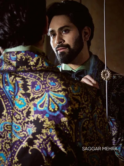 This perspective showcases the intricate paisley and floral pattern on the back of the jacket. The rich colors and detailed design make it a work of art from every angle.