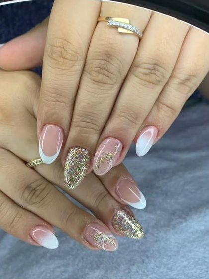 A beautiful French ombre with gold glitter accent nails. This combines two popular styles into one elegant look.