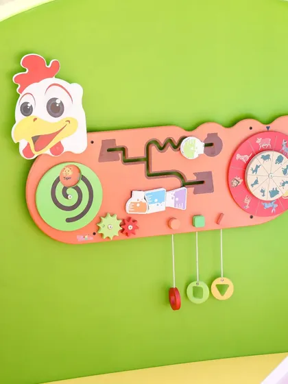 This chicken-themed sensory wall game has gears, spinners, and puzzles to keep little hands and minds busy.