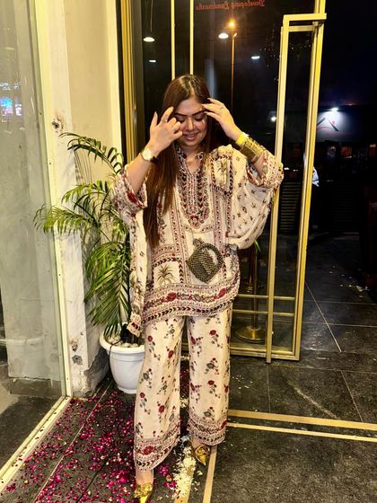 A candid moment in my festive kaftan. I love outfits that allow for movement and look great from every angle.