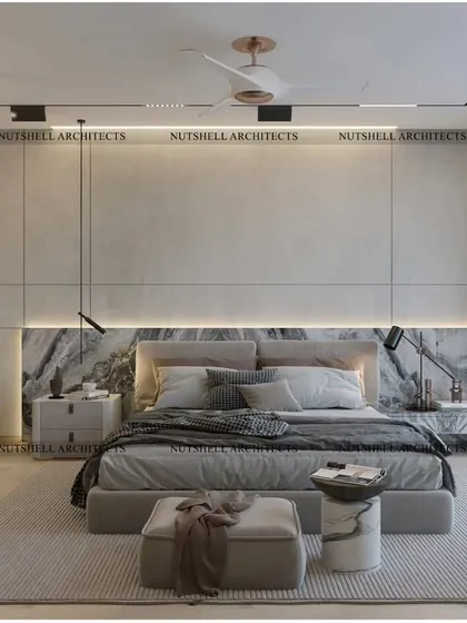 We designed this bedroom as a modern minimal masterpiece. A precious stone slab serves as the headboard, complemented by micro-concrete walls and a sculptural chandelier for a look of understated luxury.