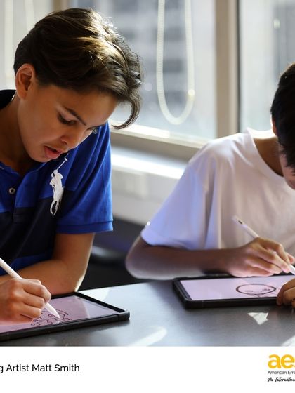 Two students concentrate on their drawings during a hands-on workshop. Our visiting artist program is a perfect example of our commitment to providing extraordinary, hands-on learner experiences.