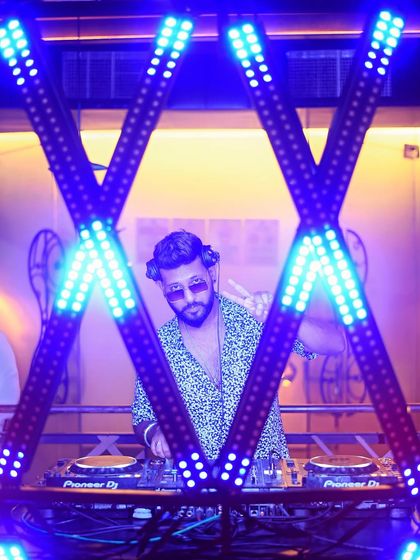 A wider shot of me framed by the lights. The visual setup is a big part of the experience I provide.