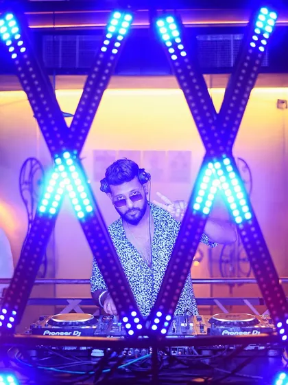 A wider shot of me framed by the lights. The visual setup is a big part of the experience I provide.