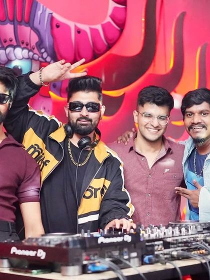 All smiles with the boys at the DJ booth.