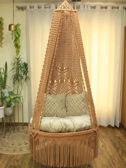 This high-quality swing in a light brown color features our signature floral pattern. It's a versatile piece that fits well in any corner of your home.