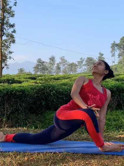A low lunge with a twist is a fantastic dynamic hip opener. It stretches the hip flexors of the back leg while opening the chest and spine.