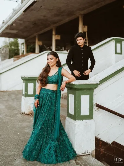 A portrait that blends modern style with classic romance. We use the architectural elements of a venue like the Mahalaxmi Racecourse to frame our couples, creating editorial shots that are both elegant and full of personality.