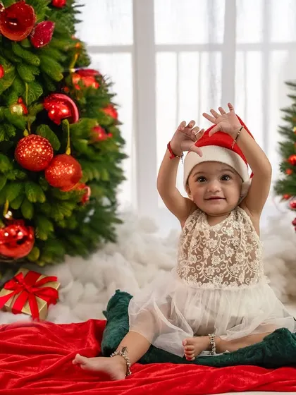 A happy wave from this little Christmas elf. Her joy and excitement for the season are palpable.