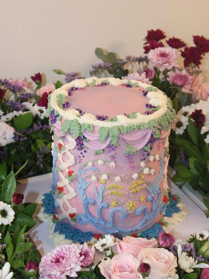 A garden in buttercream. This cake features incredibly detailed, multi-colored piping that creates a stunning floral tapestry. It’s a perfect example of how we make it personal and unforgettable.