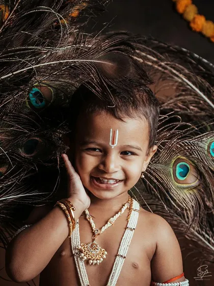 Look at that smile. My themed kids photoshoots, like this little *Krishne* session for Janmashtami, are all about capturing pure joy. I create a fun environment where kids can be themselves, resulting in portraits full of personality.