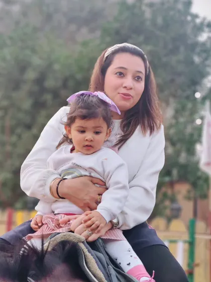 A close-up shot of a mother and her young child sharing a special moment during a horse ride.