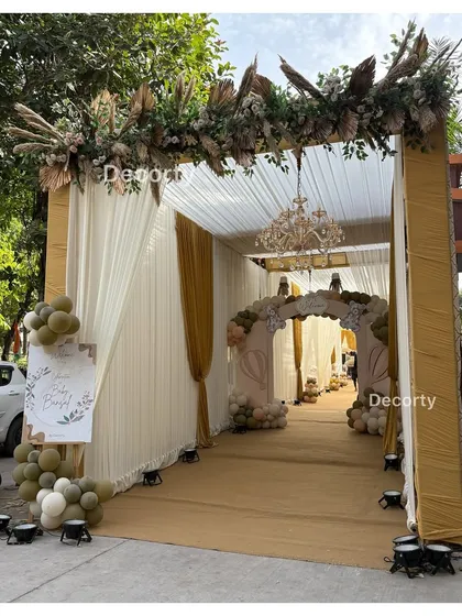 The grand draped entrance tunnel, creating a sense of anticipation and luxury for the guests.