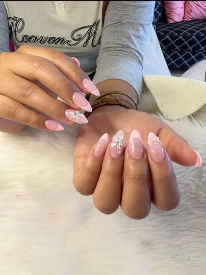 Flexi 3D nails with delicate, lacy white floral designs on a sheer pink base.