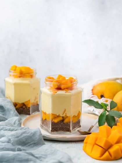 Our Mango Mousse Jar is a light and airy dessert. We layer velvety smooth mango mousse over a cocoa biscuit crumble and top it with fresh diced mangoes.