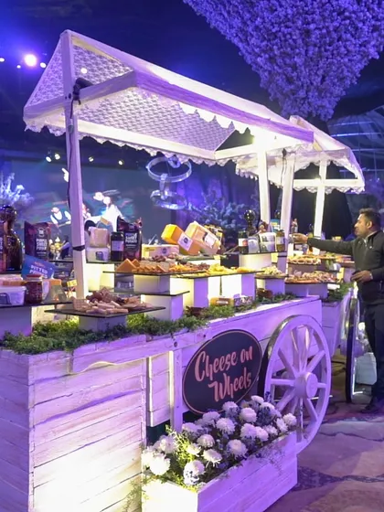I love to bring a touch of whimsy to luxury. Our "Cheese on Wheels" cart is an interactive station offering a curated selection of international cheeses, crackers, and fruits, rolling through the event to delight your guests.