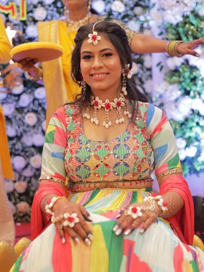 A smiling portrait of the Haldi bride, looking radiant and ready for the ceremony.