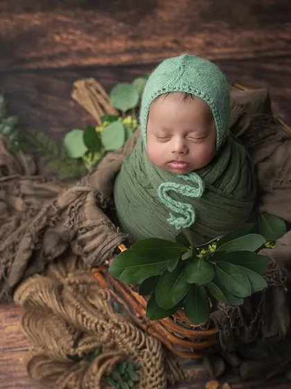 A rustic, woodland-themed setup using deep greens and natural browns. The addition of fresh leaves adds an organic touch.