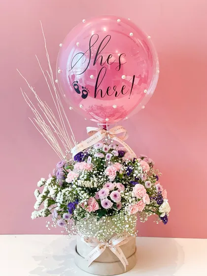 A full view of the floral announcement hamper, combining fresh flowers with a celebratory balloon. It’s a beautiful and sophisticated way to share the happy news.