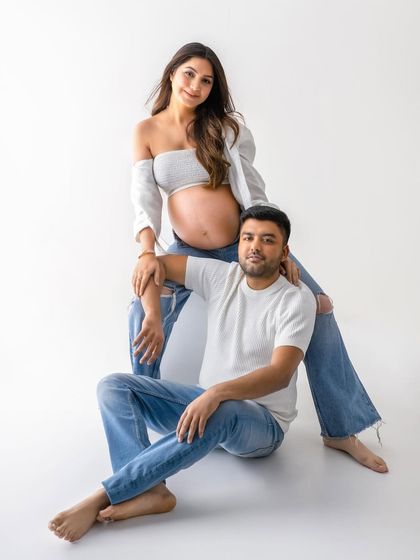A relaxed and stylish couple's portrait. This pose feels natural and loving, perfectly capturing their partnership on this incredible journey.
