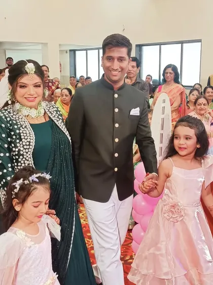 The grand entrance of the parents-to-be with their daughters at a baby shower. It was a beautiful moment that set the tone for a day of family celebration and joy.