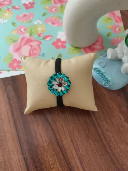 My collection of decorative elastic hair bands. Each one features a unique handmade centerpiece, including gotapatti, Kundan work, zardozi, and bead embroidery.