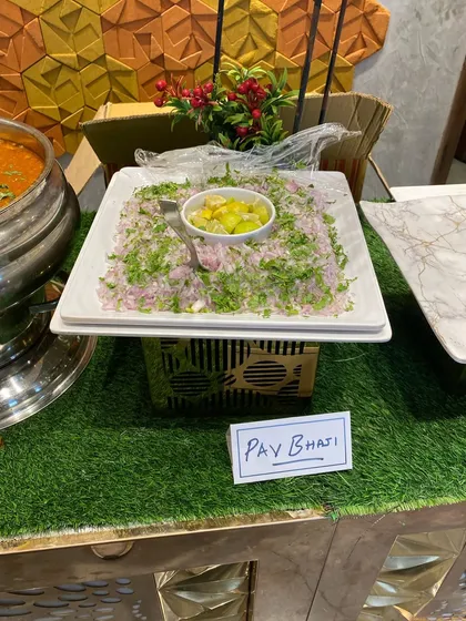 The setup for our Pav Bhaji, with finely chopped onions and a wedge of lemon to add that extra zest.