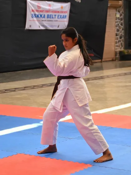 Focus and form on full display. A student demonstrates her kata during an SSKKA belt exam, a crucial step in her journey toward mastering Shito Ryu karate. Each exam is a test of skill, spirit, and perseverance.