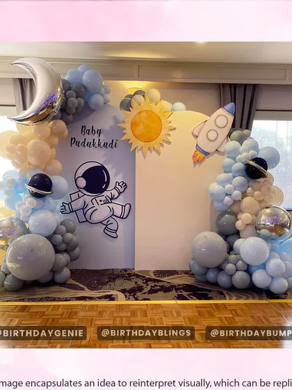 A charming and simple space theme for a "First Trip Around the Sun" birthday. The pastel blue and cream balloons, along with cute astronaut and rocket graphics, create a soft and dreamy atmosphere.